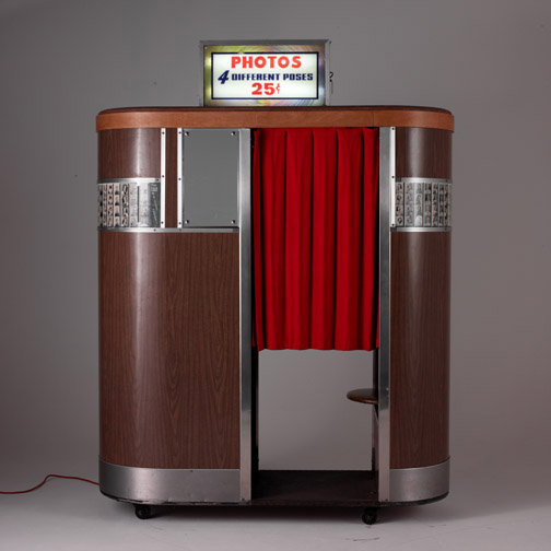 A photo booth is a vending machine or kiosk which contains an automated, usually coin-operated, camera and film processor.